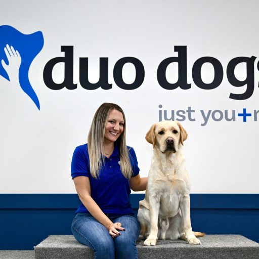 Erin sitting next to Duo Dog Banyon