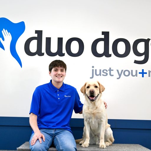 James sitting with Duo Dog Woody